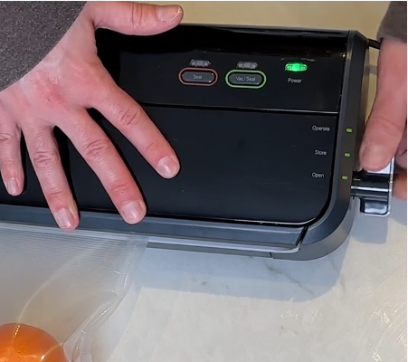 Vacuum sealer lid being firmly latched closed